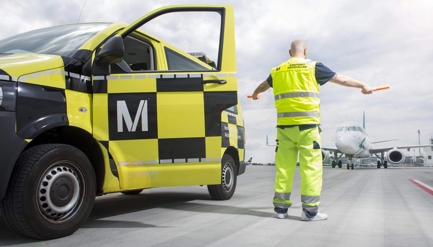 Aircraft marshaling at Munich Airport Ramp attendants guide pilots when maneuvering on the apron.