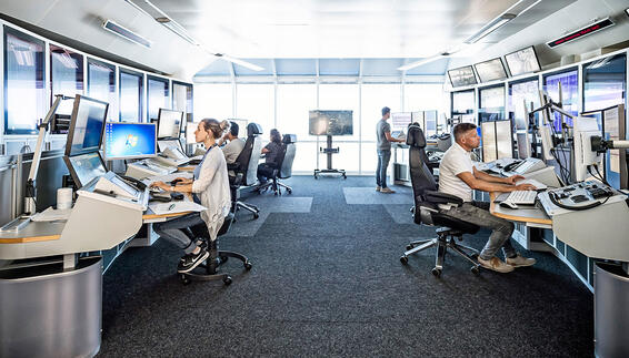 people working in a control centre at Munich Airport