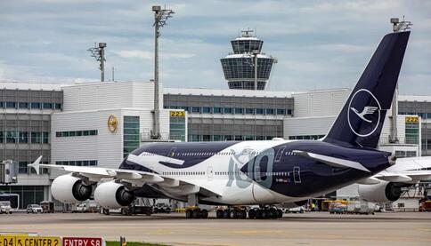 Lufthansa Airbus A380 Lufthansa Airbus A380 on the apron at Munich Airport, with the iconic control tower and terminal providing the backdrop for the wide-body aircraft.